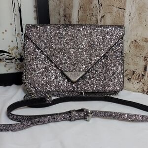 Rebecca Minkoff Molly Glitter Leather Crossbody Clutch Bag in silver. 